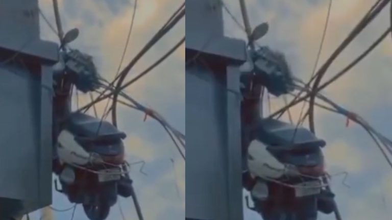 Scooty Hanging From a Building